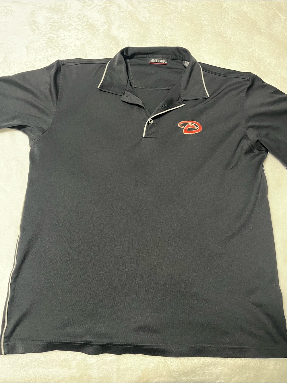 Antigua Black Polo with Red Team Patch and White Trim